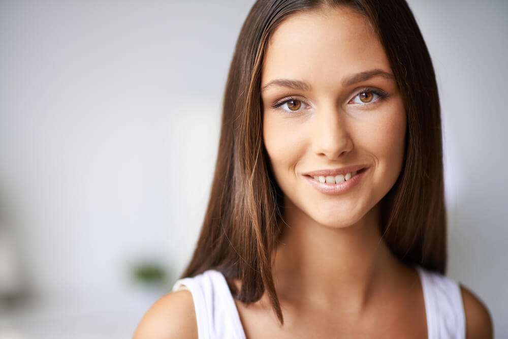 Close up of smiling woman with long hair
