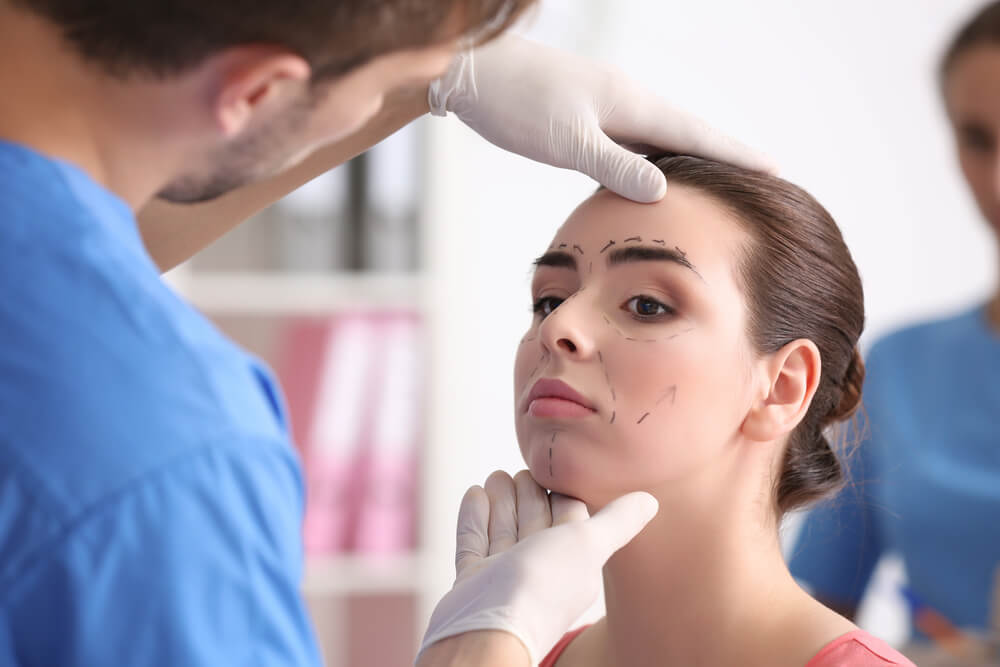 Woman getting her face prepped for plastic surgery